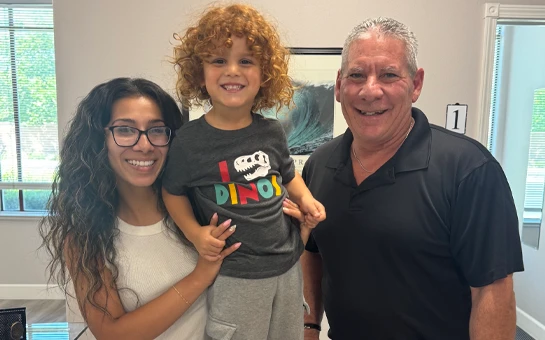 Family Posing With Chiropractic Provider